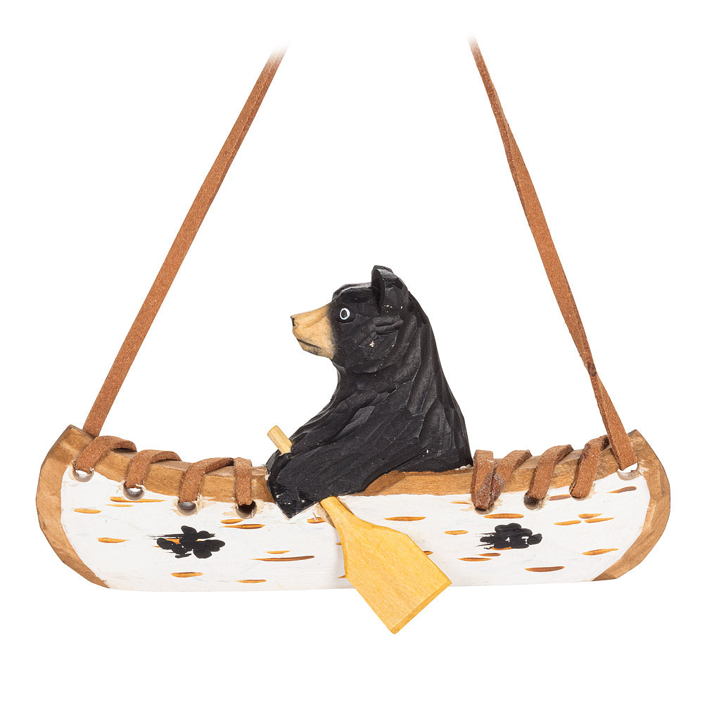 BEAR IN A CANOE CARVED ORNAMWENT